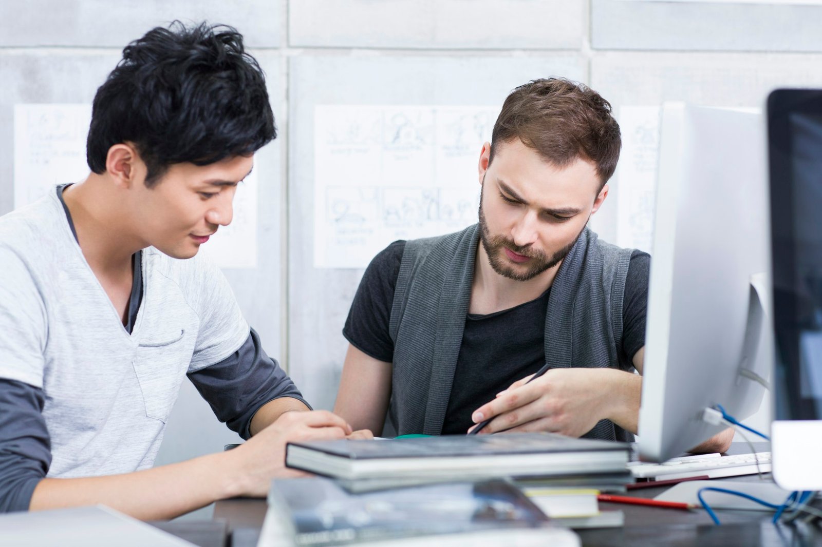 Young adults discussing in office